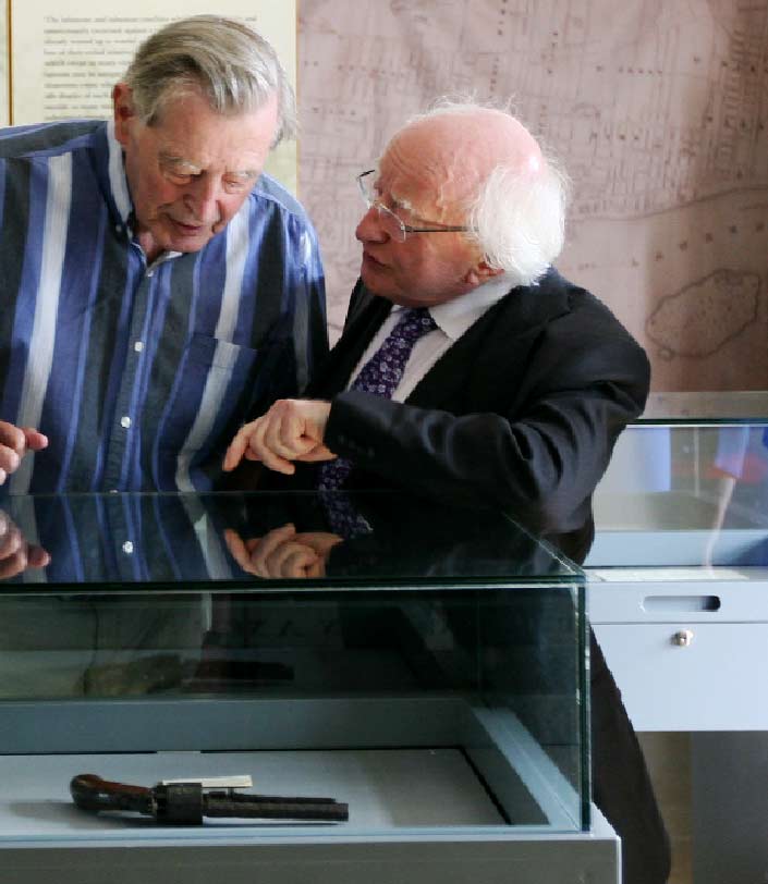 President Michael D. Higgins surveying an exhibit in the National Famine Museum.