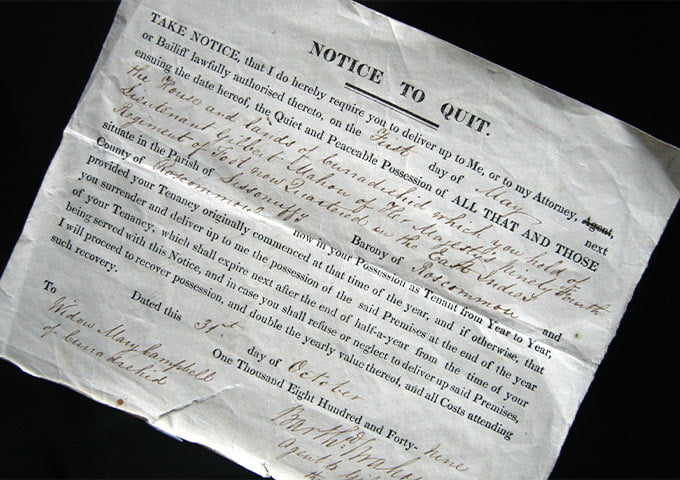 An old, slightly crumpled notice to quit document with formal text and ornate handwriting detailing a tenant's eviction.