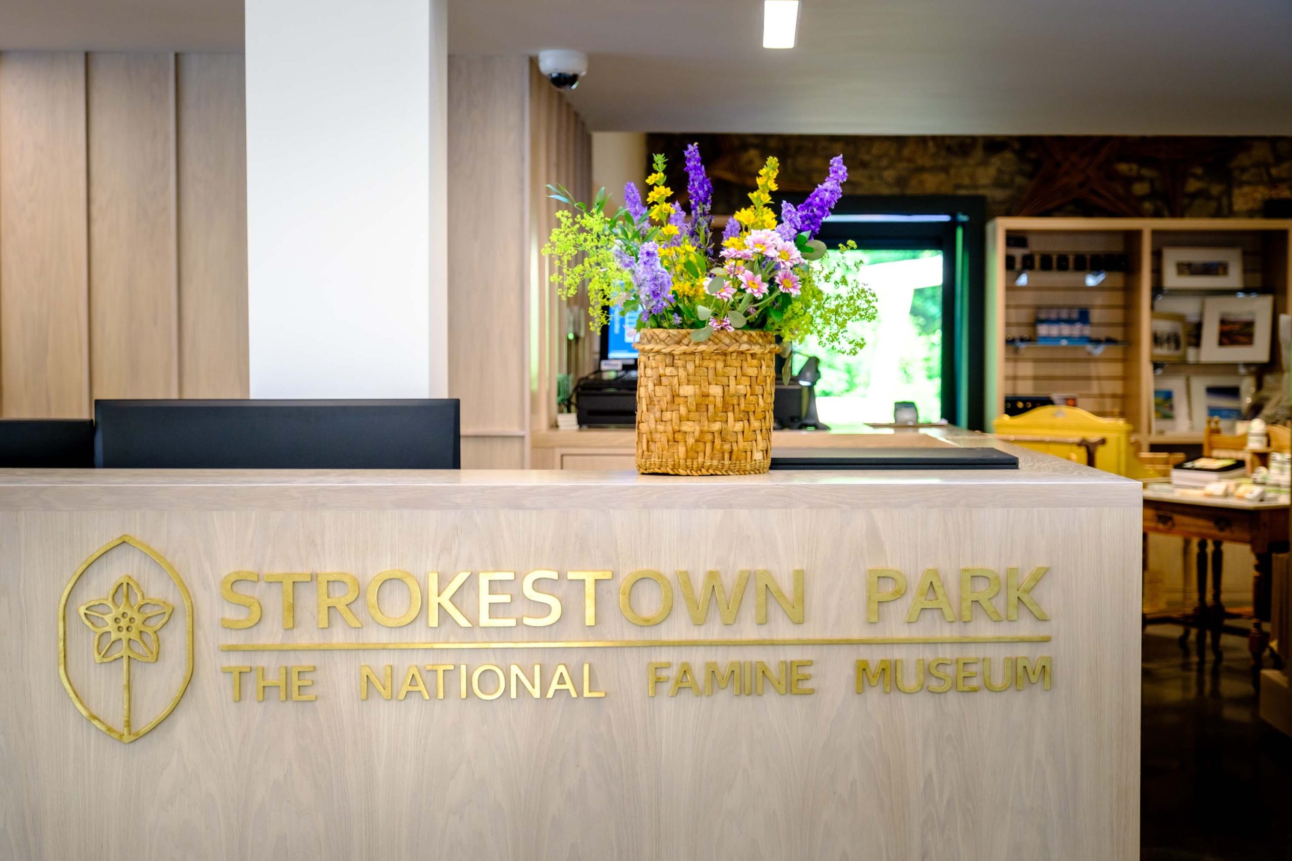 Welcome desk with flowers above Words Strokestown Park, the National Famine Museum