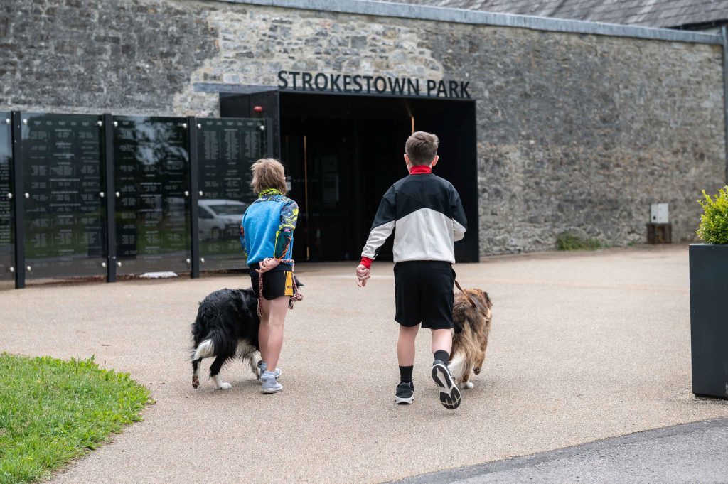 French Toast with berries from the walled gardens Two boys walking with dogs towards the entrance of Strokestown Park and the National Famine Museum. The Famine Wall Memorial is to the left of the entrance.