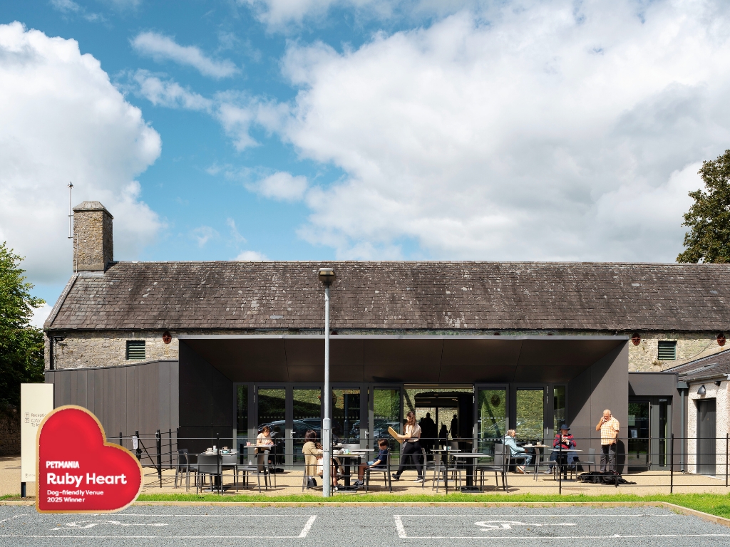 The outside of Strokestown Park Cafe with the Petmania Ruby Heart Logo signifying their award for Dog Friendly Venue 2025